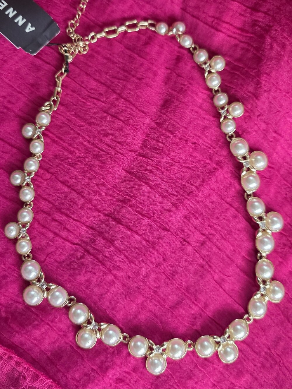 Anne Klein Gold Accent White Faux Pearl Segmented Statement Necklace.